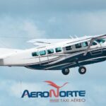 Aeronave da empresa Aero Norte em voo, especializada em serviços de táxi aéreo.